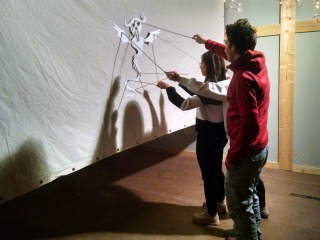 Two students using shadow puppet