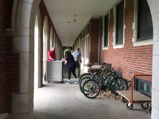 Americorps volunteers deliver meals in the loggia