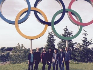 Donna Vinter and students stand in front of Olympic Rings in London 2012