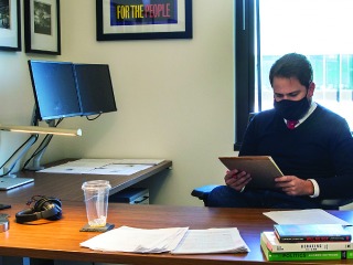 Sheahan Virgin '08 working in his office