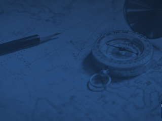 Blue tinted image of a compass and map on desk with small Project Muse logo in the corner