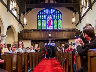 Faculty and College Leadership walk into Herrick Chapel to start the 2017 Endowed Chair Ceremony. 