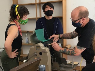 Rich Dana and students using a mimeograph machine