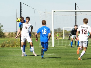 Yang blocking opposing team from the ball