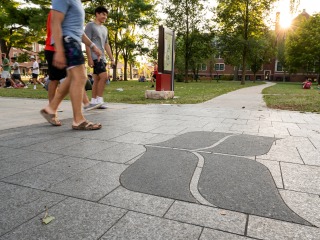 Students walking on campus at new student orientation 