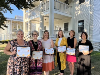 Award Recipients in front of Nollen House