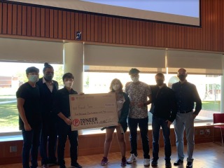FoodSavr team holds their oversized first-place prize check.