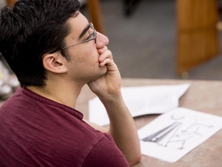 A student listens thoughtfully in a philosophy class
