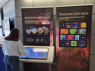 person looking at Observing with NASA Kiosk
