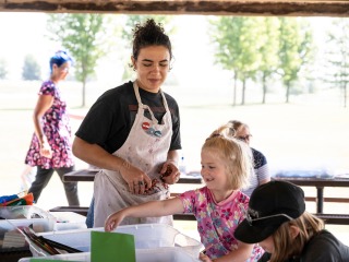 children playing with art at the park