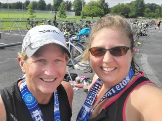 Rachel Bly, right, with friend Cat Campbell Currier after one of the 26 sprint triathlons they completed toward their goal of finishing one in every state.