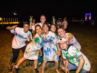 Students celebrating on Mac Field during pre-orientation programs.