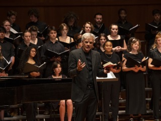 John Rommereim leads the Grinnell Singers at a concert in Sebring-Lewis Hall