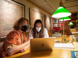 Deborah Michaels works one-on-one with a student