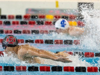 swimmer competing in the pool