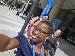 Essi takes a selfie in front of the medical conference building.