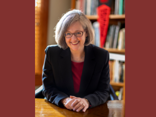 President Anne F. Harris at her desk