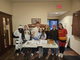 Marissa Goffman '24 with students during a Purim fundraiser for a local nonprofit.