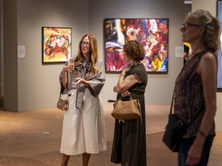 3 people looking at art in the gallery
