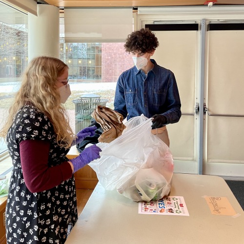 students working on compost recycling
