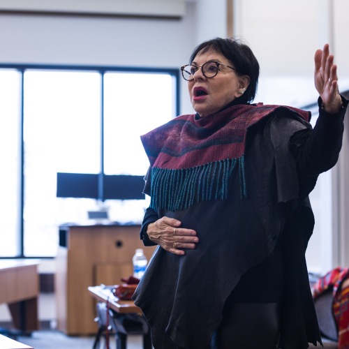 LeAnne Howe gestures as she leads a writers workshop for Grinnell students and faculty