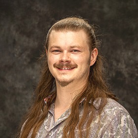 Headshot of Jadyn V. Breland, Assistant Professor of Mathematics at Grinnell College.