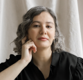 Author photo showing latina woman with curly black hair