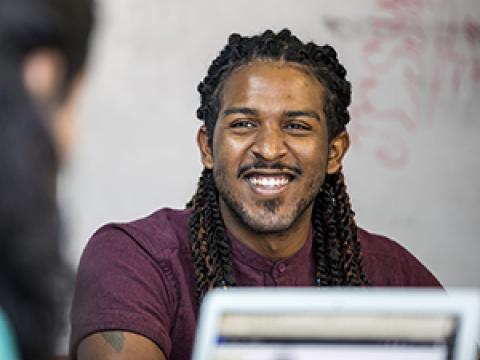 Erin Whalen ’12 talking with a student