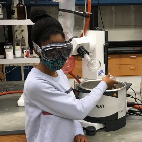 Ariel Richards with equipment in the lab.