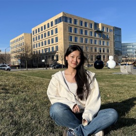 woman sitting in front of a building