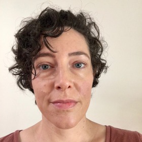 woman with dark curly hair