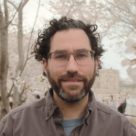 headshot of man with dark hair