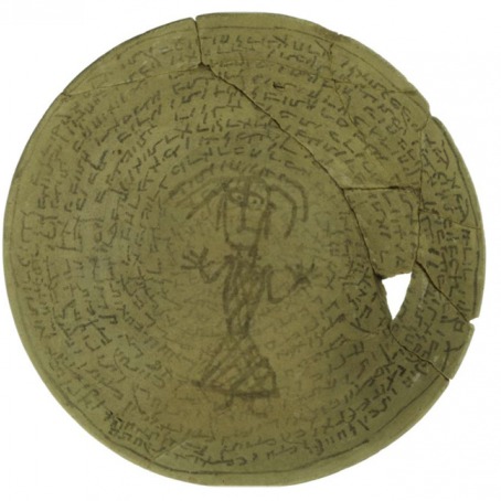shattered bowl with script and what appears to be a stick figure of a person in a long garment