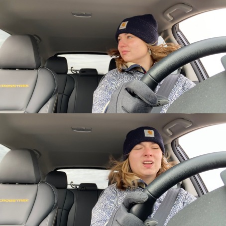 Two video frames are shown, of a girl in a winter coat, hat and gloves driving her car. In the upper frame, she looks out the window. In the second frame, her face is scrunched with disgust.