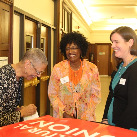 Dianne Jones ’74, left, Kesho Scott, and Dinah Zebot ’03 share a laugh before the gala dinner where the Dr. Kesho Scott Leadership and Community Development Fund was announced.