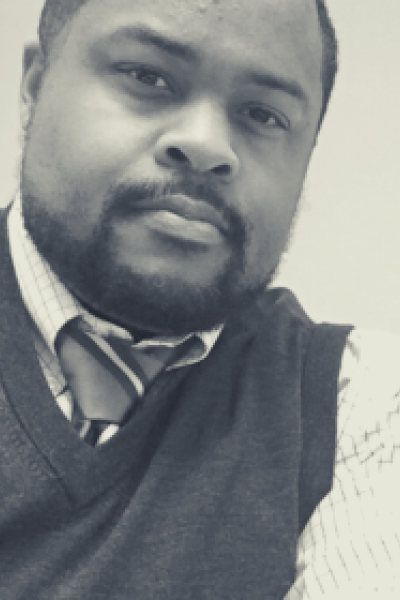 Image of Darrius D. Hills, a religious studies associate professor at Grinnell College
