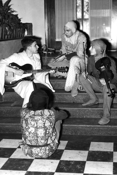 Male students in costumes in this black and white vintage photo