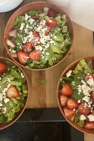 A view of three lovely salads with strawberries