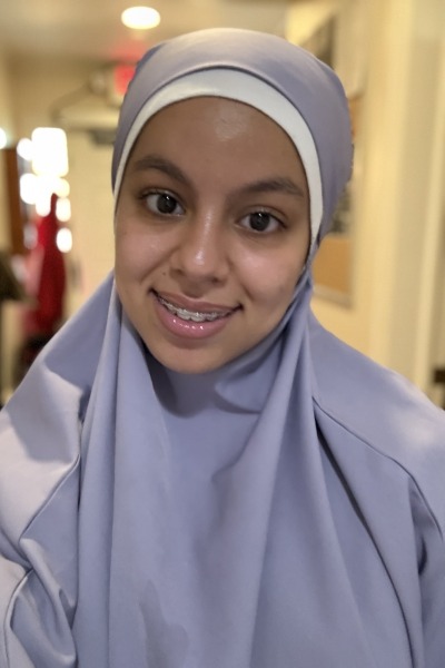 Nour Yousfi wearing a light purple head covering