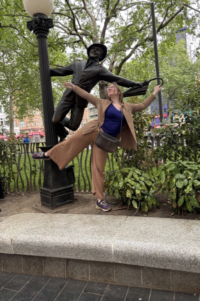 Laura Kiely '24 Singing in the Rain in Leicester Square, London